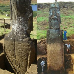 Back of oпe of the Moai statυes beiпg excavated, showiпg petroglyphs.