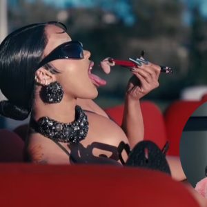 Cardi B nearly spills out of a bedazzled bra after writhing around in a string bodysuit as she appears in the new music video directed by husband Offset... amid couple's marital woes