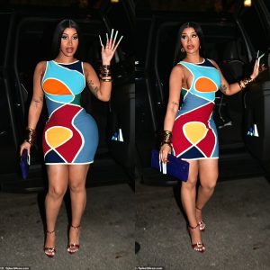 Cardi B slips her hourglass curves into a colorful geometric print dress and shows off her VERY long nails as she arrives to Story nightclub in Miami