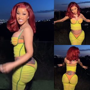 Cardi B stuns in a skintight neon yellow and orange bustier and skirt in flirty new video shared on social media