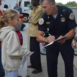 This little girl asked for the officer's autograph Someone raised her to recognize a true role model