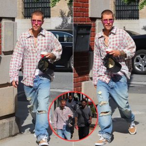 Justin Bieber cuts a casual figure in plaid button up and jeans for a stroll in New York City